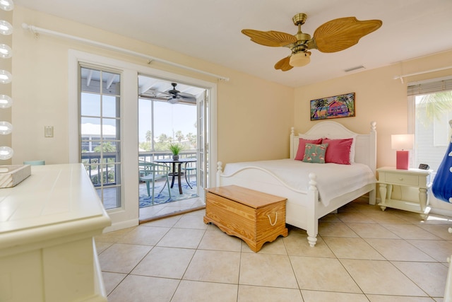 bedroom with visible vents, a ceiling fan, light tile patterned floors, and access to outside