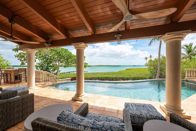 37 Cannon Royal Dr, Shark Key, FL 33040 - swimming pool featuring a water view, ceiling fan, and a patio area