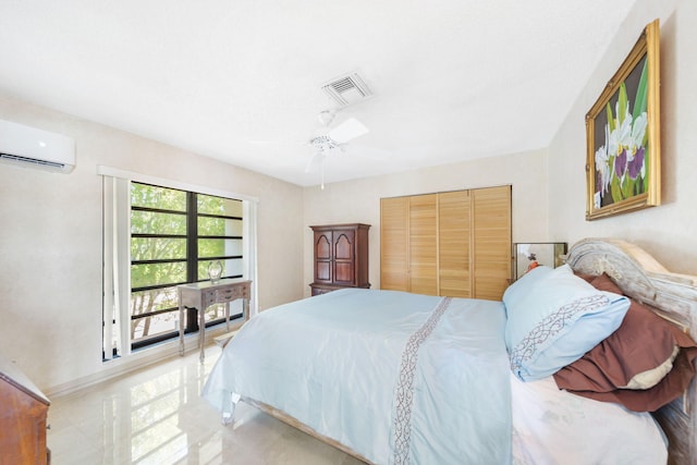 bedroom featuring an AC wall unit, ceiling fan, and a closet