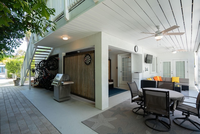 view of patio featuring ceiling fan, area for grilling, an outdoor hangout area, and french doors