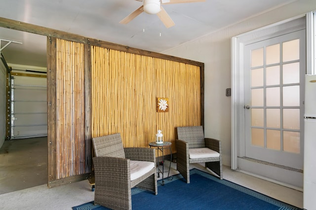 sitting room featuring ceiling fan