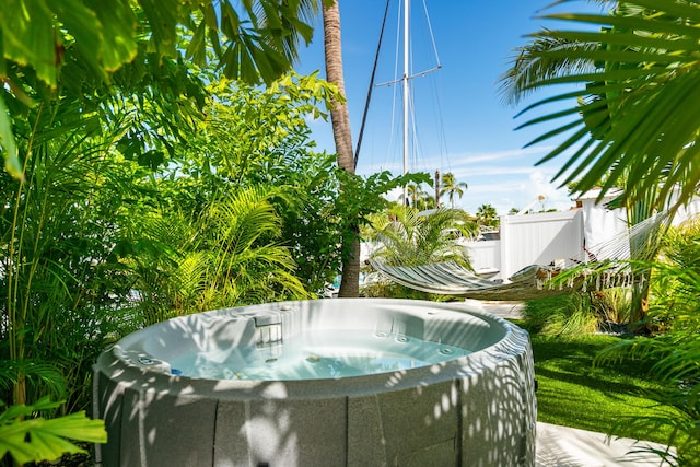 view of pool with a hot tub