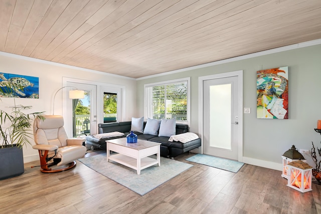 living room with crown molding, hardwood / wood-style floors, wooden ceiling, and french doors