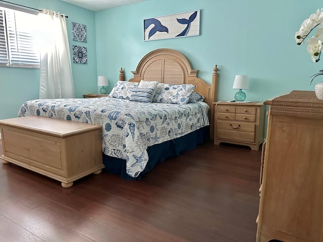 bedroom featuring dark hardwood / wood-style floors