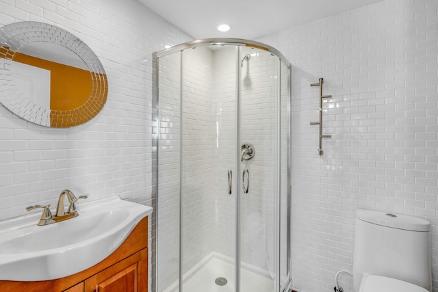 225 Colson Dr, Cudjoe, FL 33042 - full bathroom with a shower stall, toilet, vanity, and tile walls