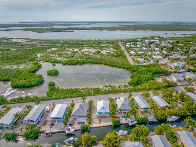 birds eye view of property with a residential view and a water view