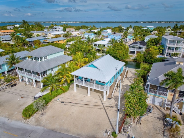 aerial view with a water view and a residential view