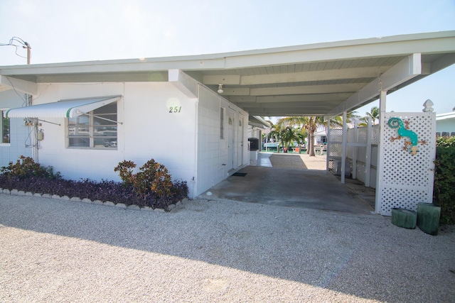 view of property exterior featuring a carport