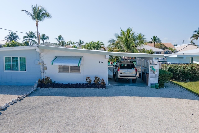 view of front of property with a carport