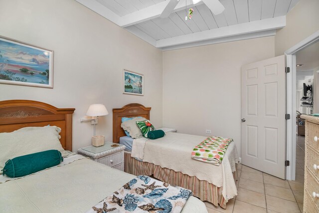 tiled bedroom featuring beam ceiling, wooden ceiling, and ceiling fan