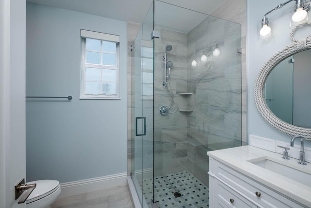 full bath featuring baseboards, toilet, a stall shower, and vanity