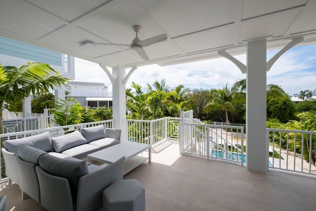 view of patio with an outdoor living space, a fenced in pool, fence, and a ceiling fan