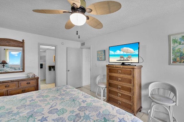 200 Wrenn St Unit 509, Tavernier, FL 33070 - bedroom with light tile patterned floors, a textured ceiling, and ceiling fan