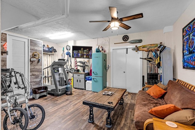 17 N Dr, Key Largo, FL 33037 - exercise room featuring a ceiling fan, a textured ceiling, and wood finished floors