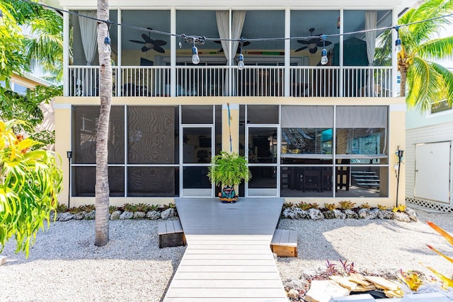 17 N Dr, Key Largo, FL 33037 - rear view of property with a ceiling fan, a balcony, and a sunroom