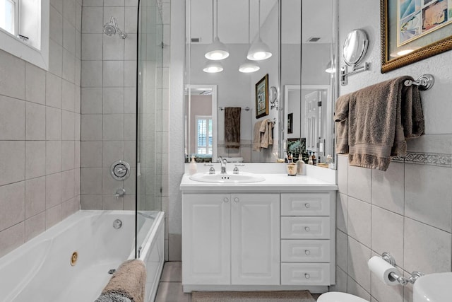 17 N Dr, Key Largo, FL 33037 - bathroom featuring vanity, tile patterned floors, a combined bath / shower with jetted tub, and toilet