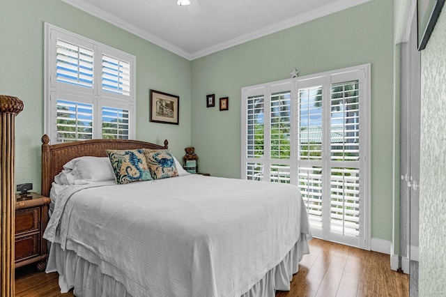 17 N Dr, Key Largo, FL 33037 - bedroom with access to outside, a ceiling fan, baseboards, wood finished floors, and ornamental molding