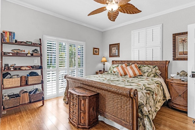 17 N Dr, Key Largo, FL 33037 - bedroom featuring crown molding, a ceiling fan, access to exterior, and light wood-style floors
