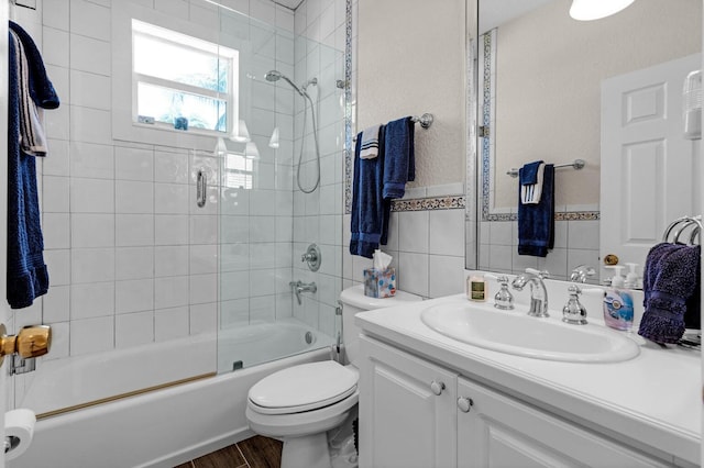 17 N Dr, Key Largo, FL 33037 - full bath featuring vanity, enclosed tub / shower combo, wood finished floors, and toilet