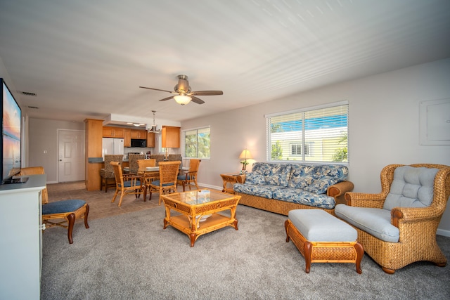 living room featuring ceiling fan and light colored carpet