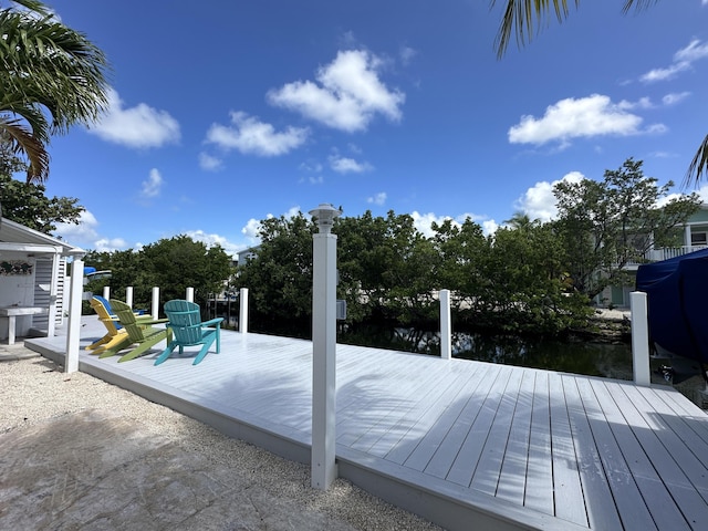 view of swimming pool featuring a dock