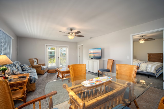 living room with french doors, ceiling fan, and carpet