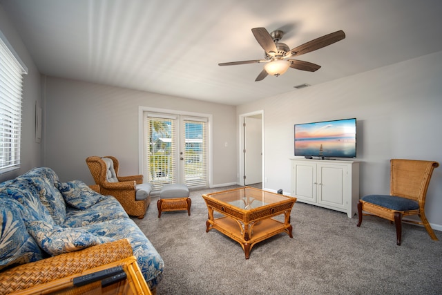 living room featuring ceiling fan and carpet floors