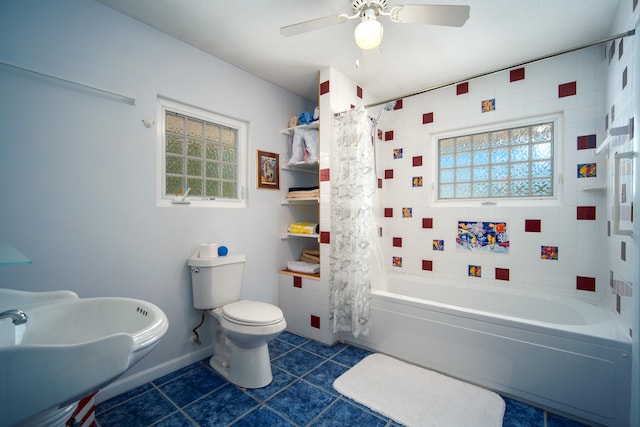 full bathroom with toilet, sink, shower / bathtub combination with curtain, ceiling fan, and tile patterned flooring