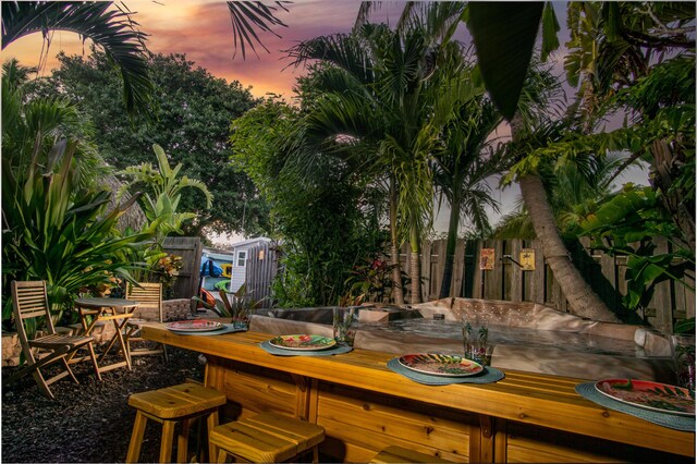 patio terrace at dusk with an outdoor bar