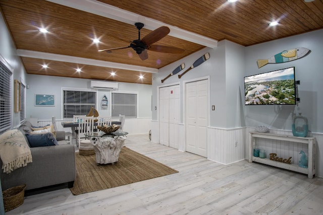 living room with a wall unit AC, beam ceiling, light hardwood / wood-style flooring, and wooden ceiling