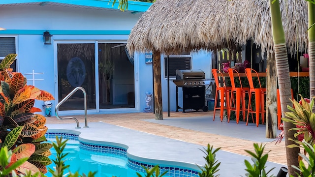 exterior space featuring a patio area and an outdoor bar