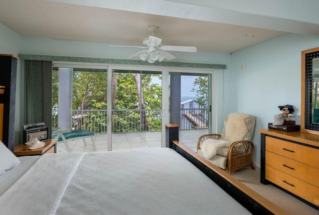 bedroom with access to outside and ceiling fan