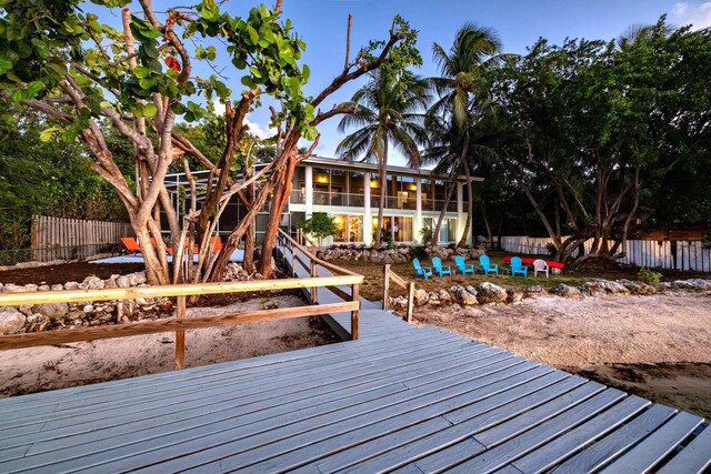 wooden terrace with a pool