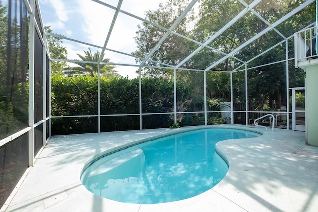 view of pool featuring a lanai and a patio