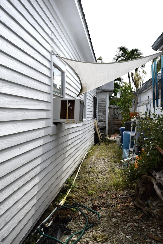 view of home's exterior featuring fence