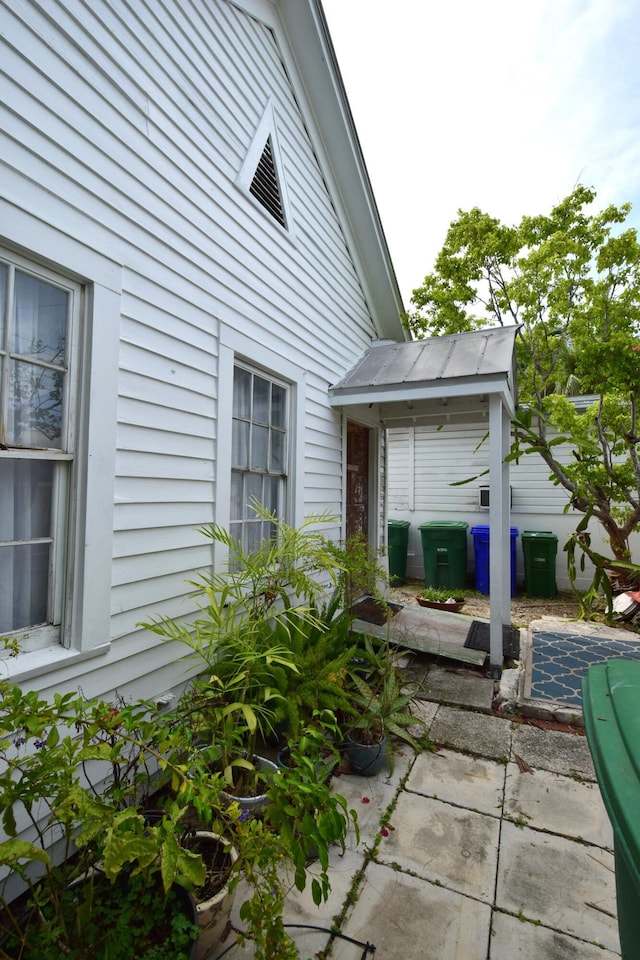 view of side of property with a patio