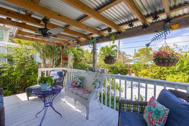 deck featuring outdoor lounge area and ceiling fan