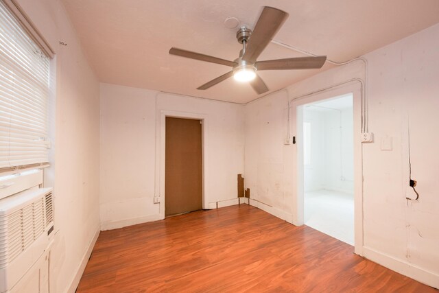 unfurnished room with hardwood / wood-style flooring and ceiling fan