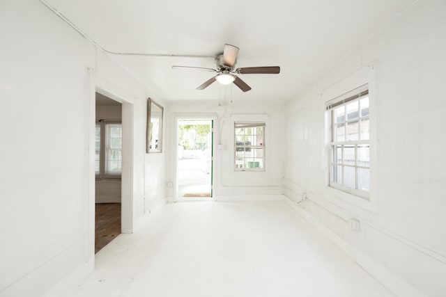 unfurnished room with ceiling fan