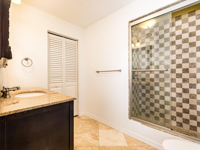 full bathroom with enclosed tub / shower combo, vanity, and toilet