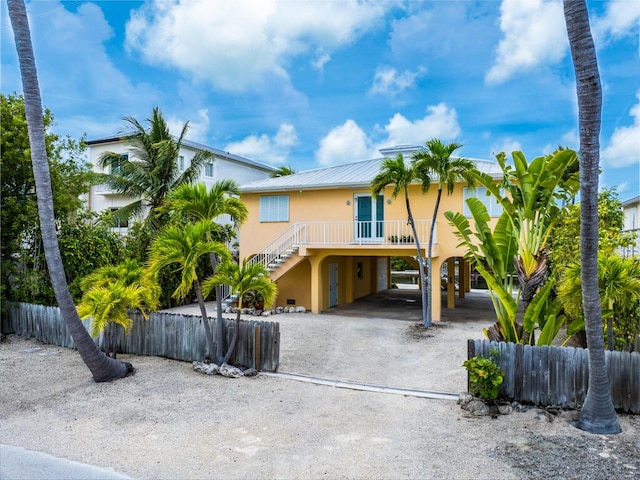 coastal home featuring a carport