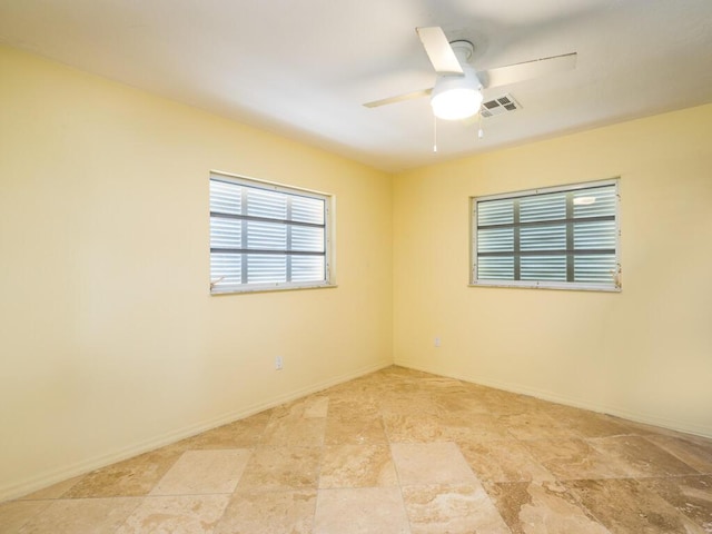 unfurnished room featuring ceiling fan