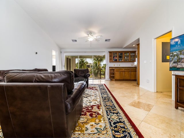 tiled living room with ceiling fan