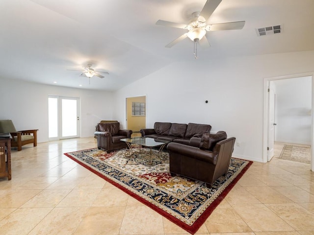 living room featuring vaulted ceiling, light tile patterned floors, and ceiling fan