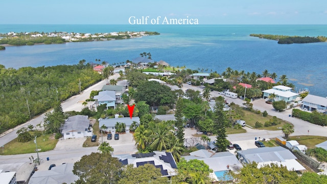 birds eye view of property featuring a residential view and a water view