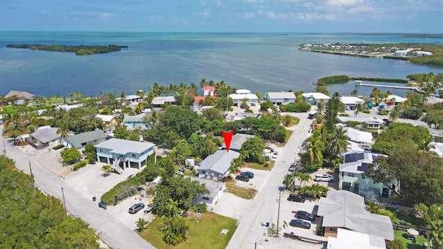 bird's eye view featuring a residential view and a water view