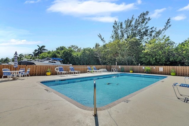 view of swimming pool featuring a patio