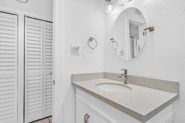 tiled bedroom with ceiling fan