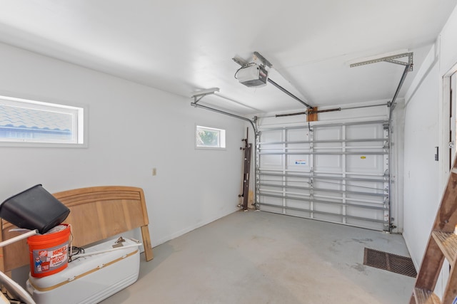 garage featuring a garage door opener