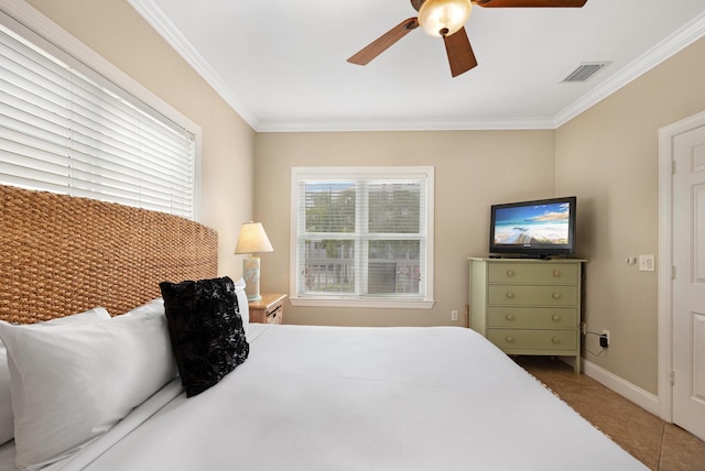 bedroom with crown molding, ceiling fan, and light tile patterned floors